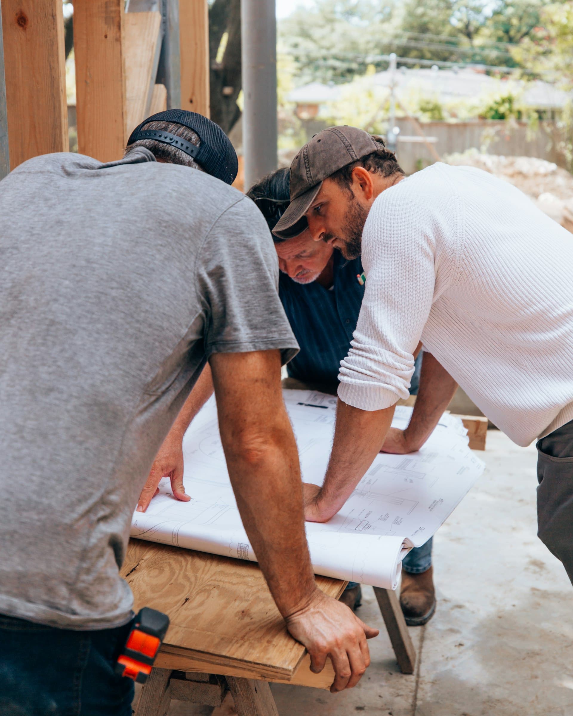 Trades team reviewing plans together on a job site